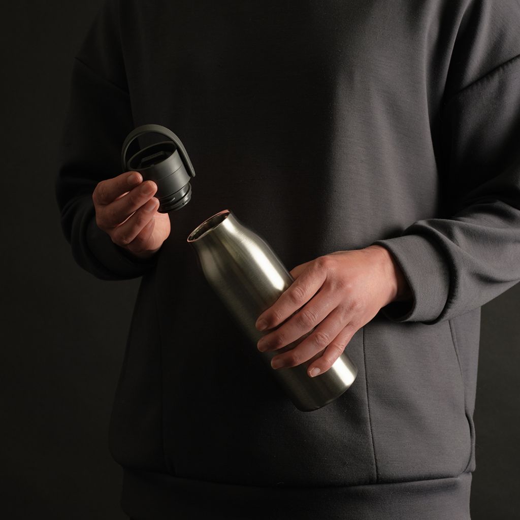 Small 500ml Stainless Steel Bottle - Storm Grey - in hands, lid off